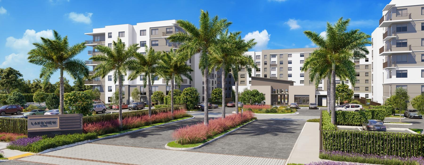 a courtyard with palm trees and buildings