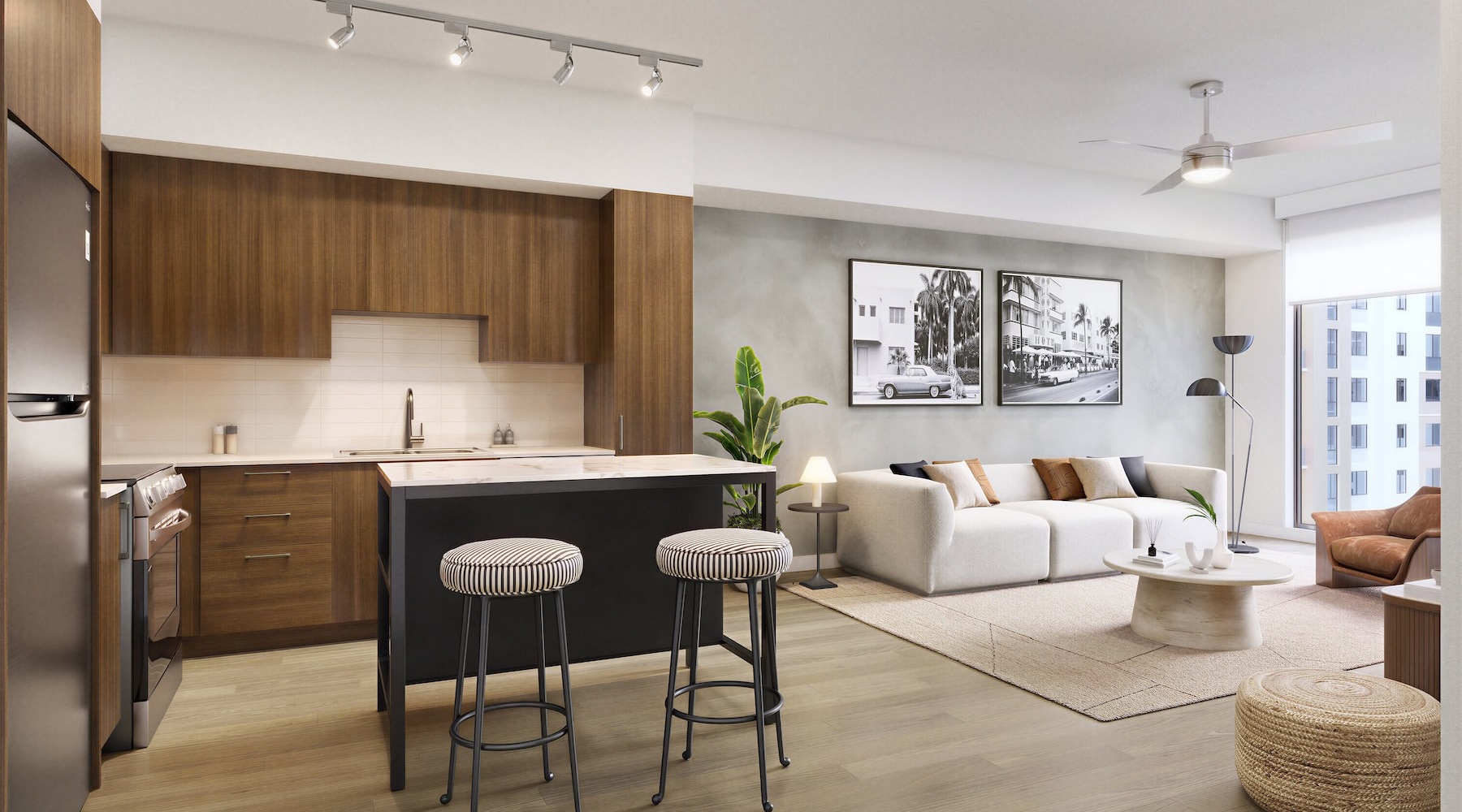 a kitchen and a living room with a couch, tables and chairs